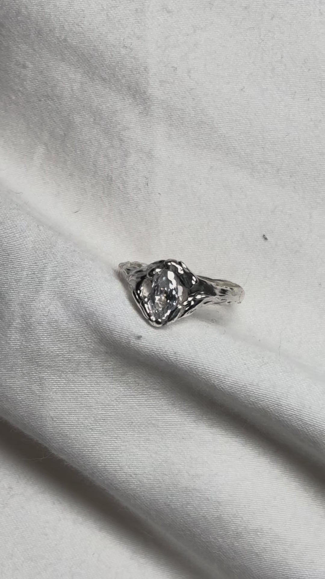 showing a sterling silver ring featuring a marquise cut zirconia